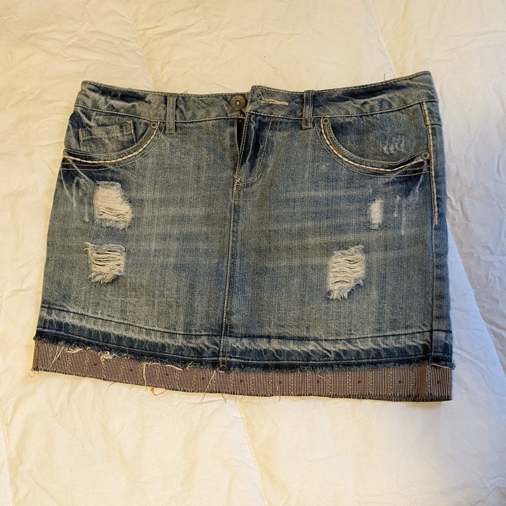Distressed denim mini skirt